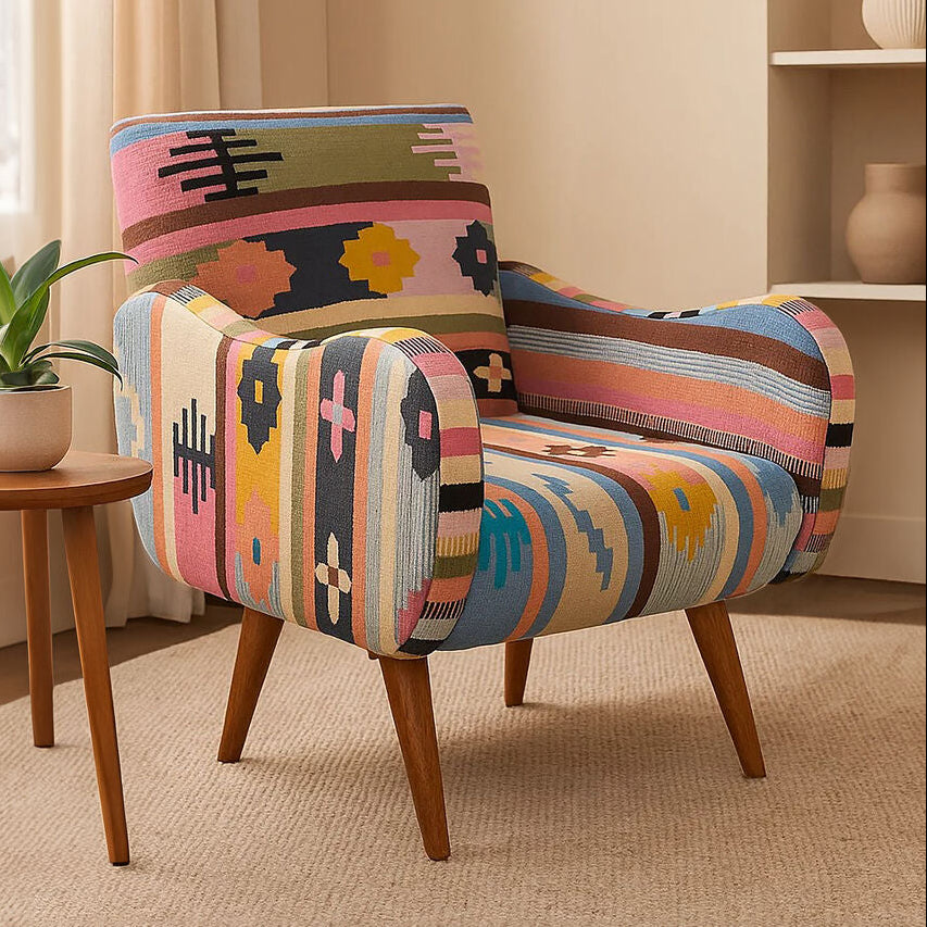 Colorful patterned armchair in a room with a small table and plant.