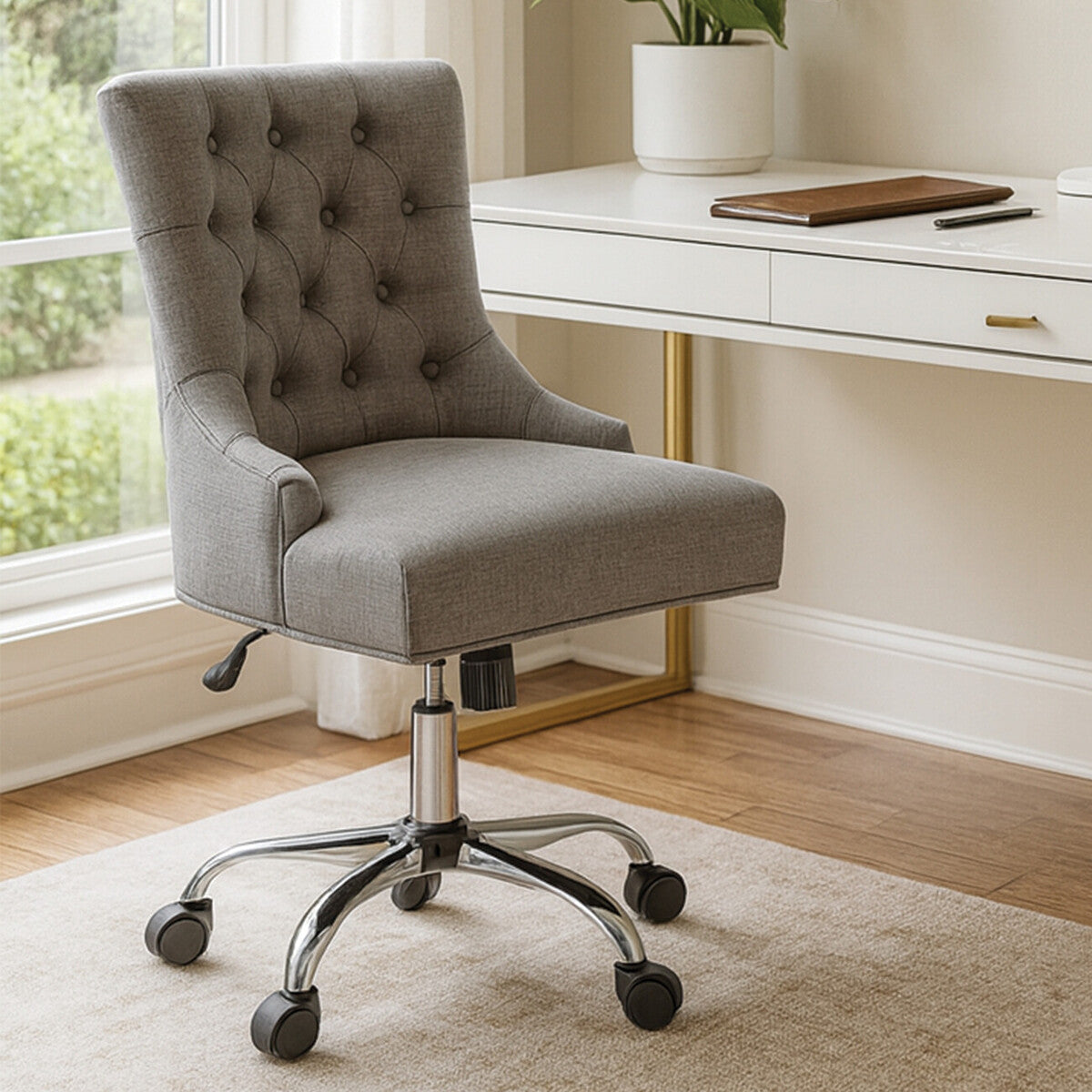 Gray office chair in a home office setting with a desk and window.