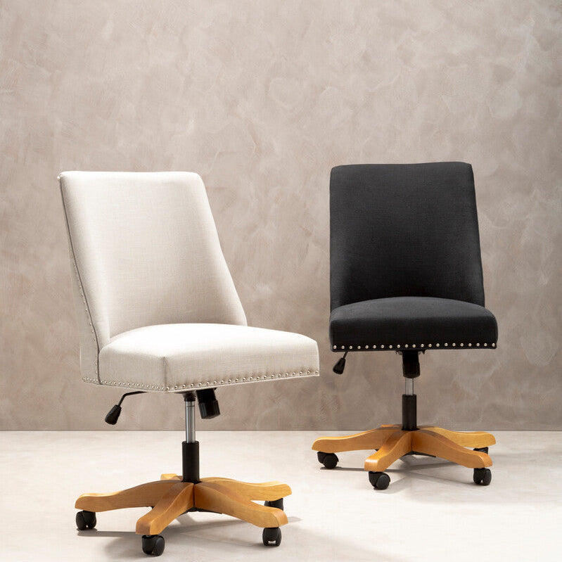 Two office chairs, one white and one black, on a neutral background
