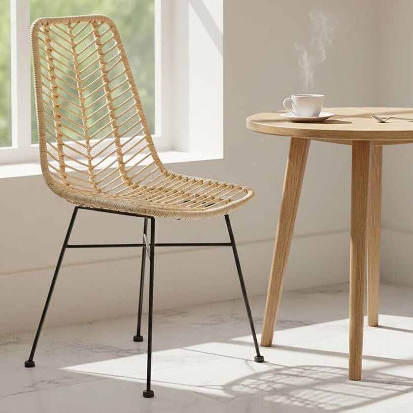 Wooden chair and table in a bright room with a window