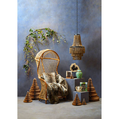 Wicker chair with decorative elements in a room setting