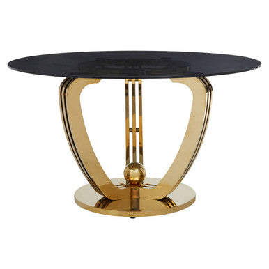 Modern side table with black glass top and gold metal base on a white background