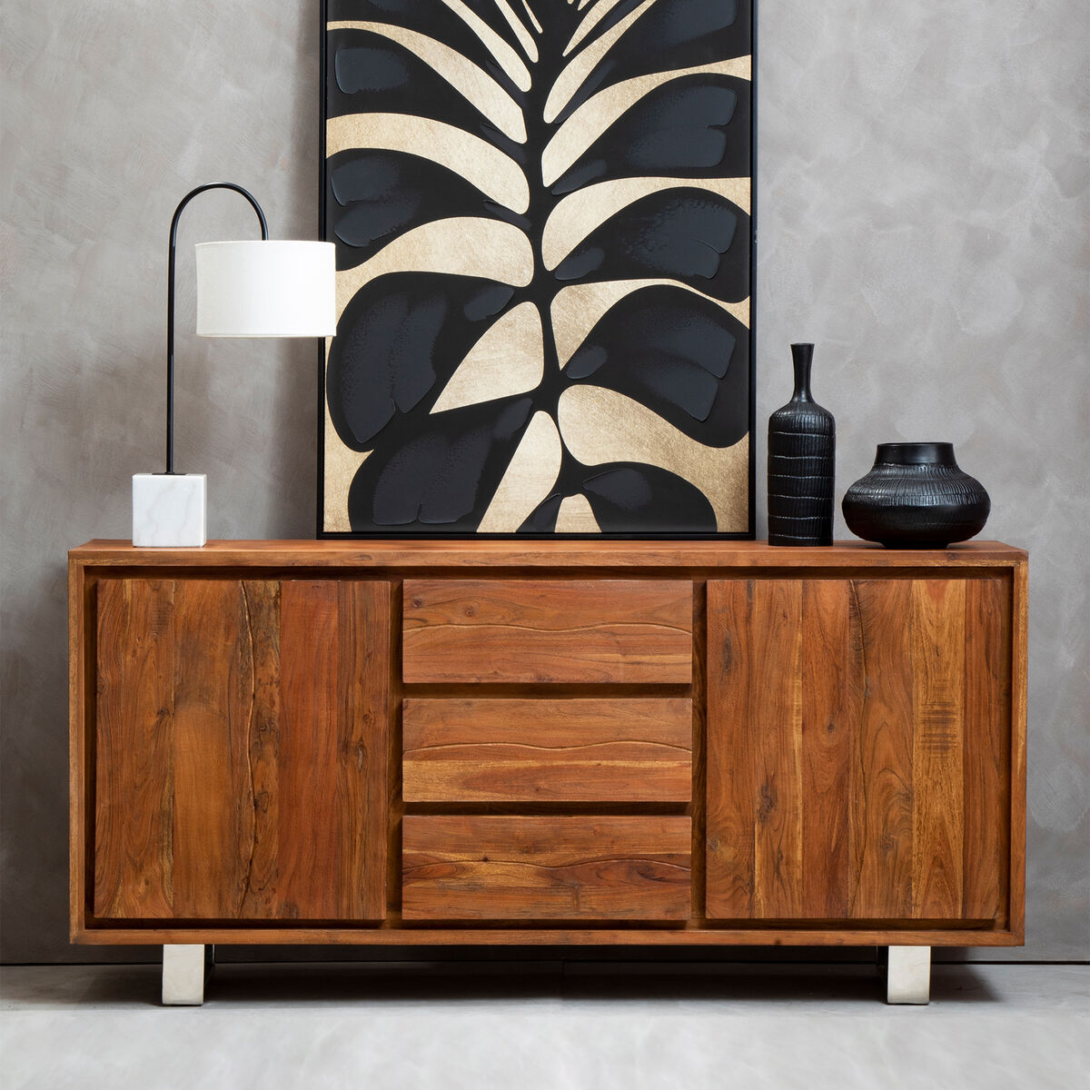 Wooden sideboard with decorative items against a gray wall