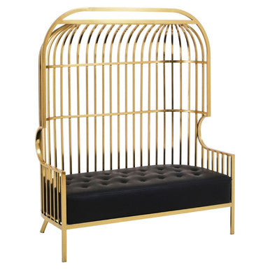 Gold birdcage-style bench with black cushion on a white background