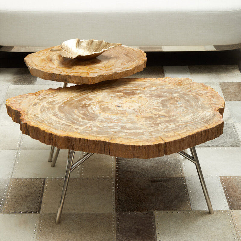 Two wooden coffee tables on a checkered floor with a white sofa in the background.