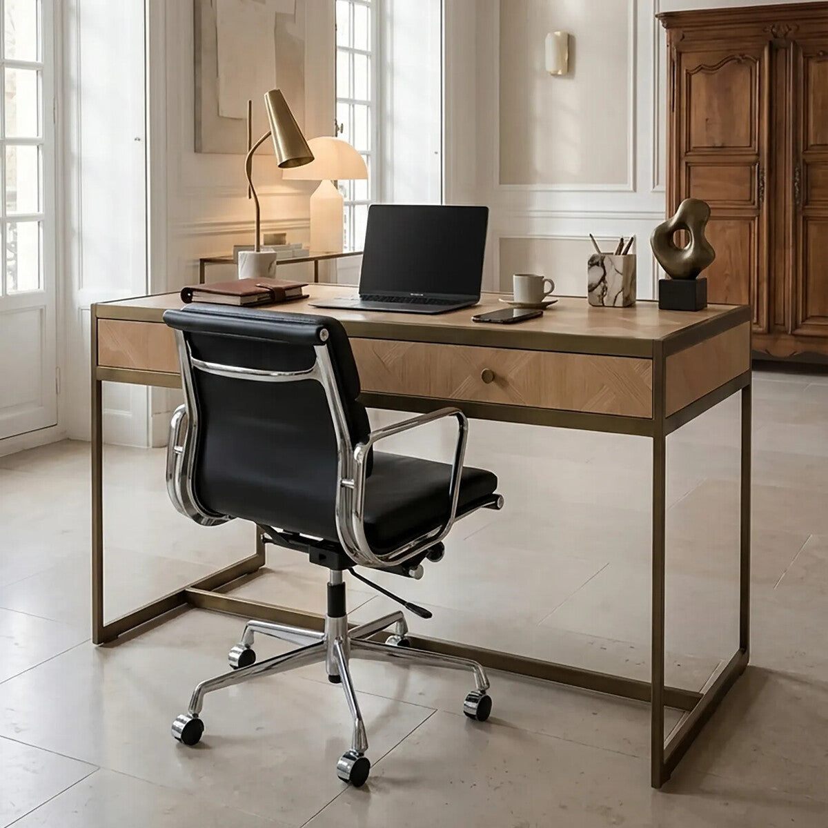 Modern office desk with black chair in a bright room