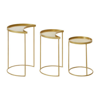 Set of three gold side tables with white tops on a white background