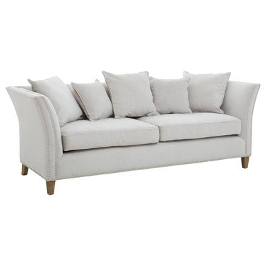 Light gray sofa with cushions on a white background