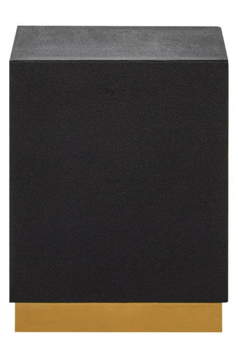 Black side table with gold base on a white background