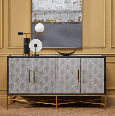 Decorative sideboard with abstract art on a wall in a room.