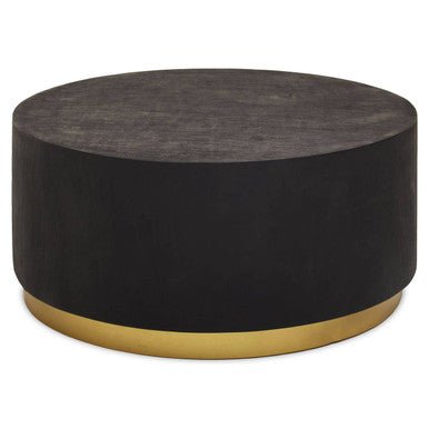 Round black coffee table with gold base on a white background