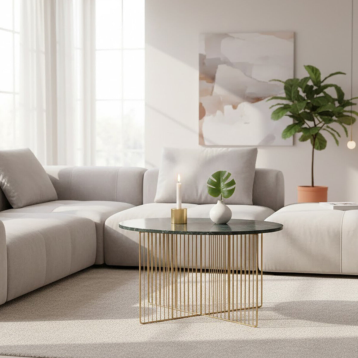 Modern living room with a gray sectional sofa, gold coffee table, and abstract painting.