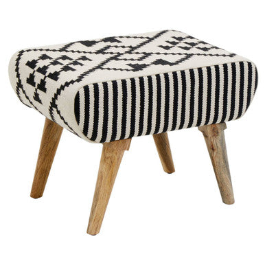 Stool with black and white patterned cushion and wooden legs on a white background