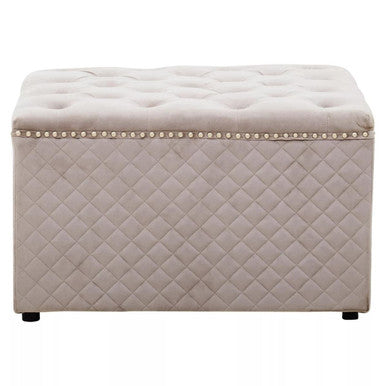 Beige quilted storage ottoman with nailhead trim on a white background