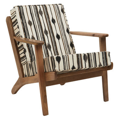 Wooden armchair with a patterned cushion on a white background