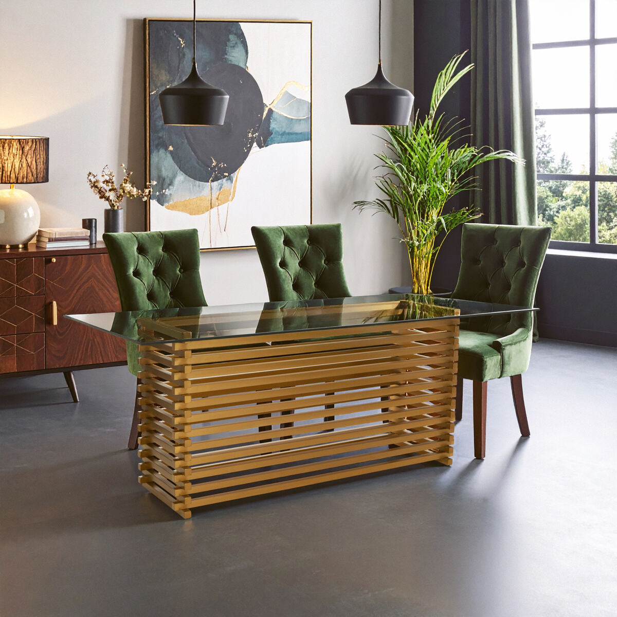 Dining room with wooden table, green chairs, and abstract art on the wall.