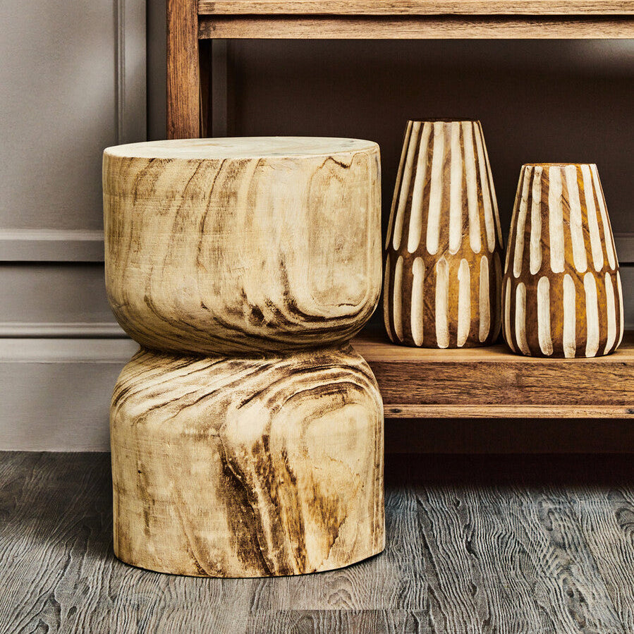 Wooden planters and vases on a wooden shelf against a gray wall.