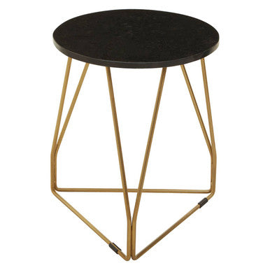 Small round table with black top and gold metal legs on a white background