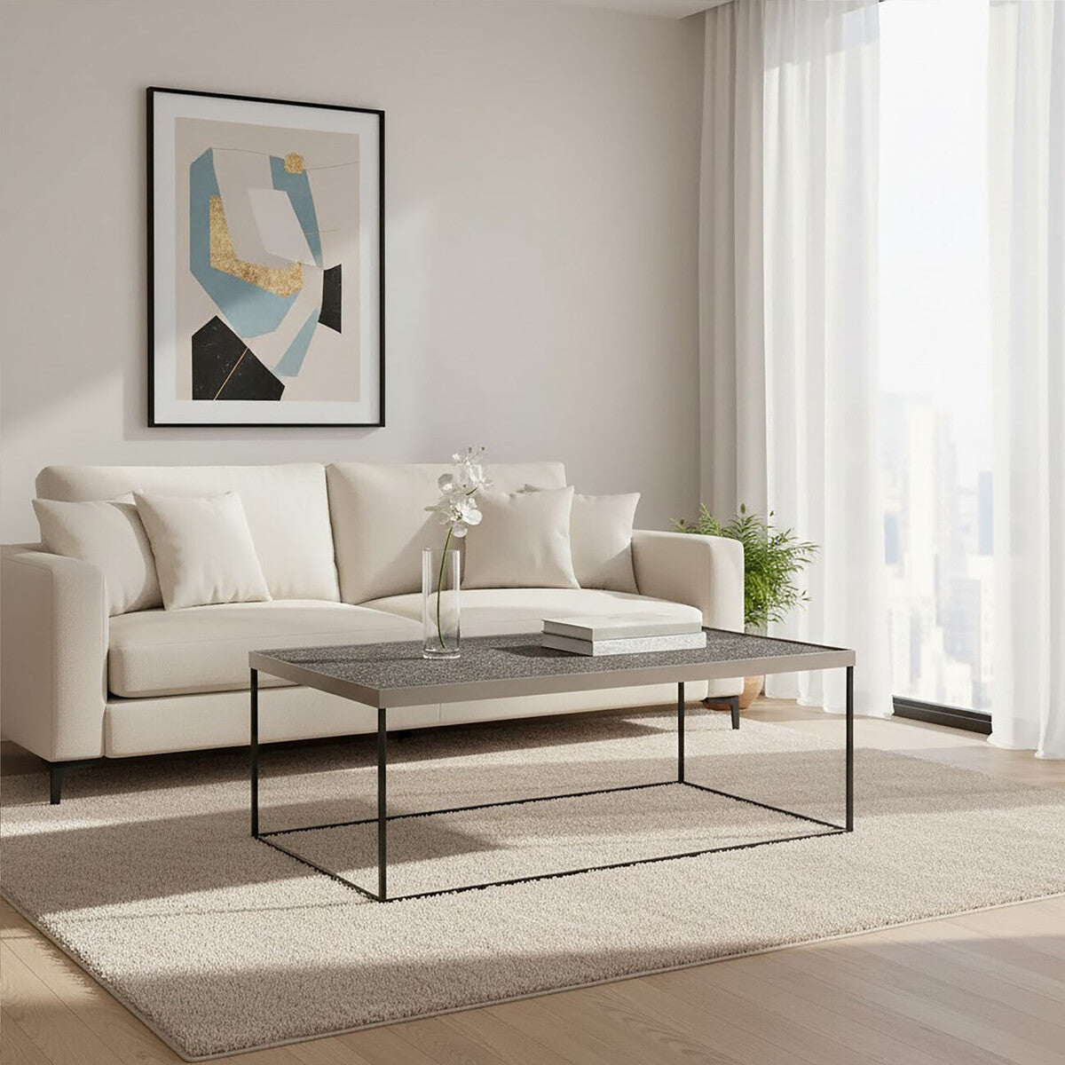 Modern living room with a beige sofa, coffee table, and abstract art on the wall.