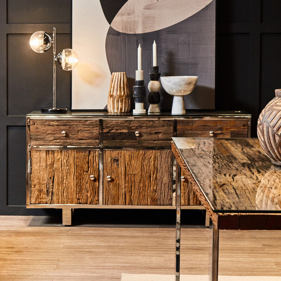 Wooden sideboard with decorative items in a modern interior setting