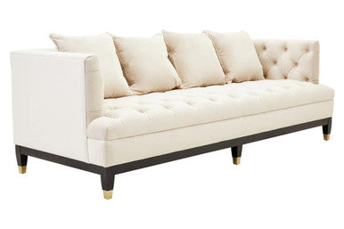 White sofa with tufted backrest on a white background