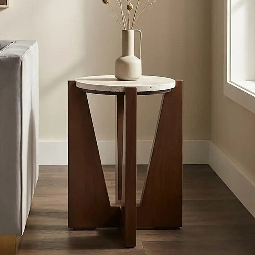 Wooden side table with marble top in a room setting