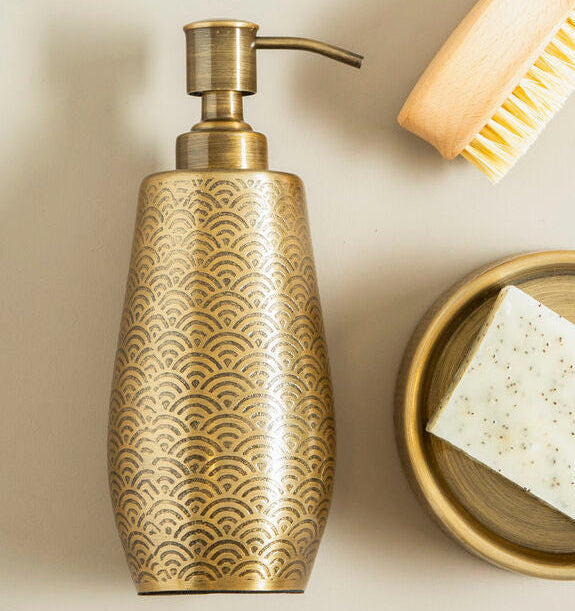 Decorative soap dispenser with a brush and soap bar on a beige background