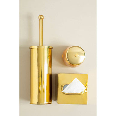 Gold toilet brush holder with a matching tissue box cover on a beige background