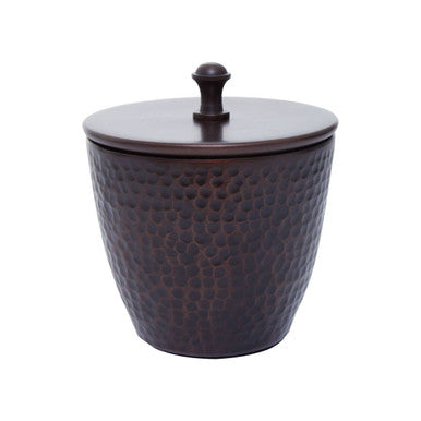 Decorative brown container with textured surface and lid on a white background