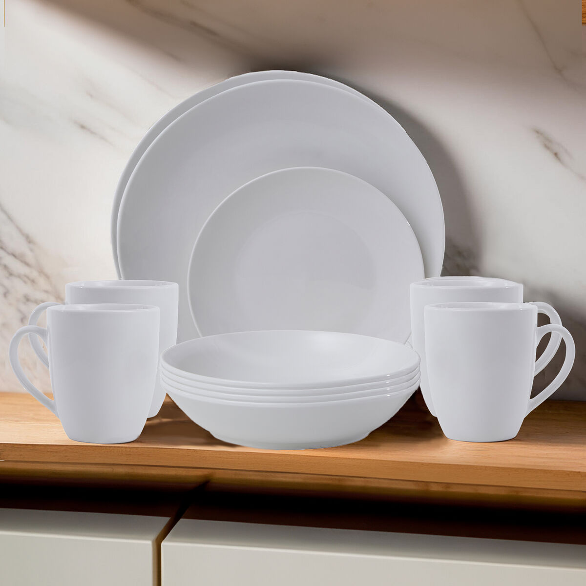 White ceramic dinnerware set on a wooden surface with a neutral background