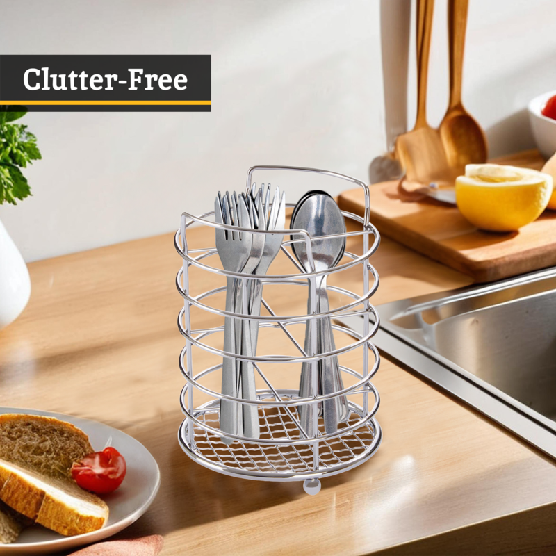 Silver utensil holder with cutlery on a kitchen counter, labeled &