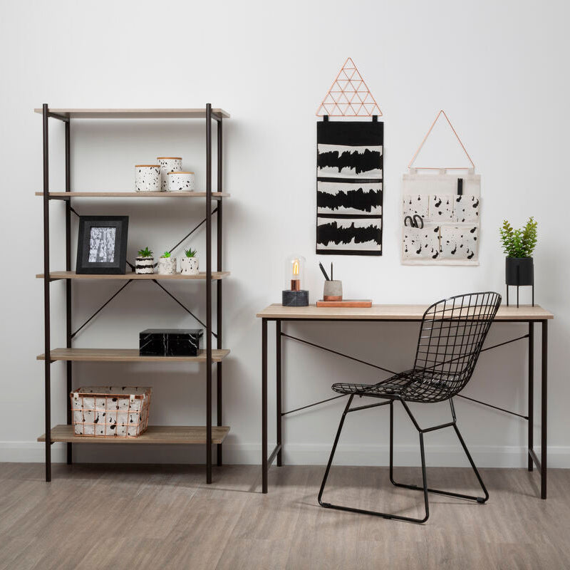 Modern office setup with a desk, chair, and bookshelf against a white wall.