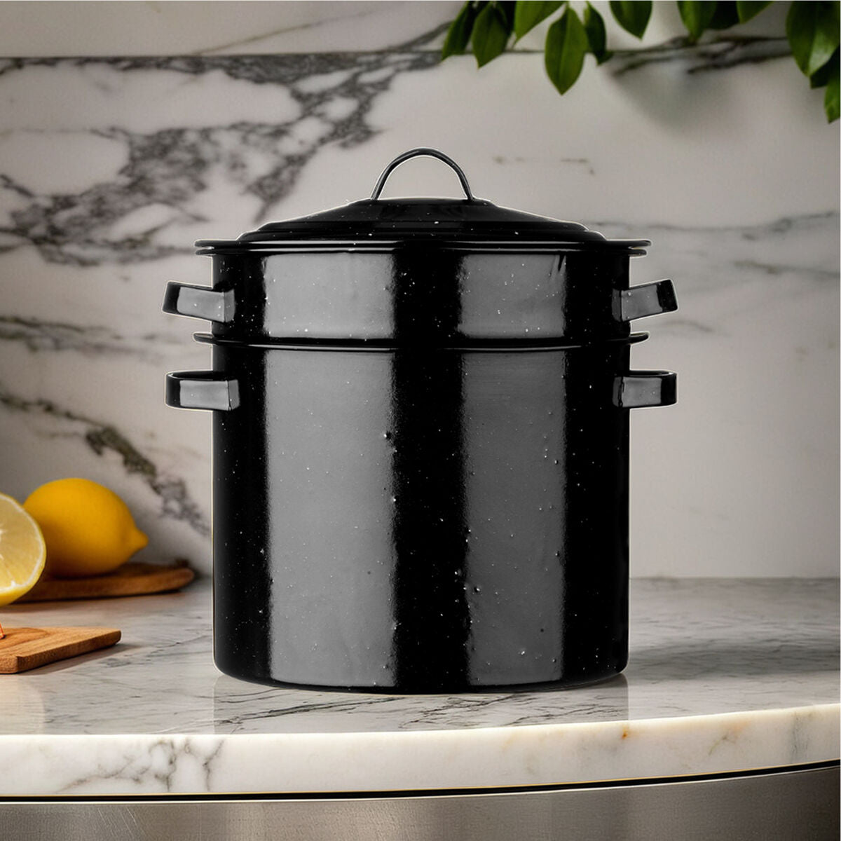 Black ceramic pot on a marble countertop with lemons in the background