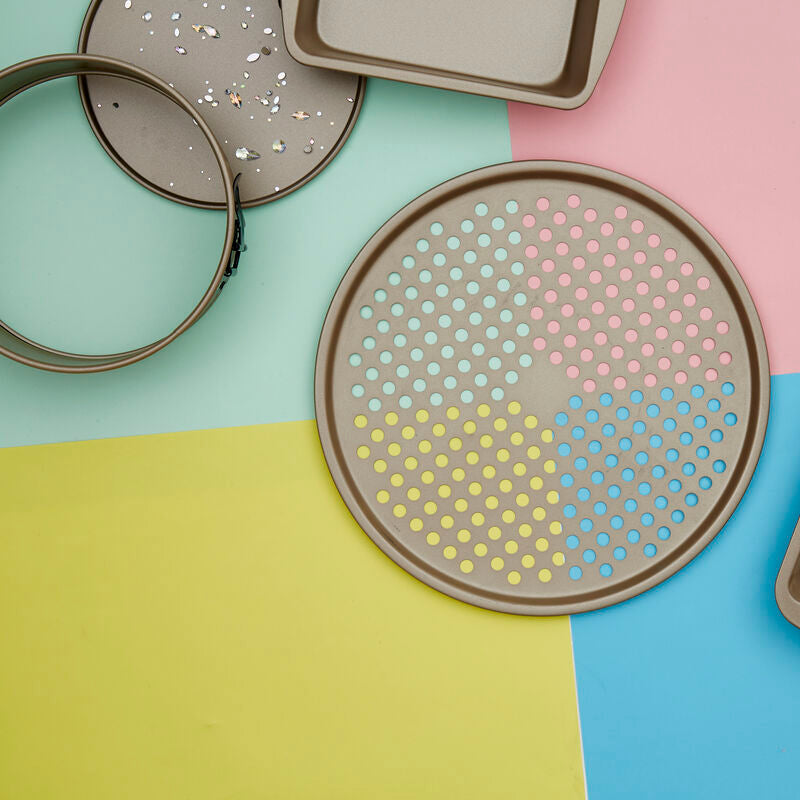 Set of terrazzo-patterned trays on a colorful geometric background