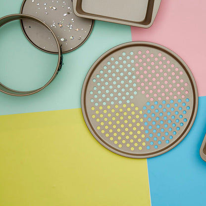 Set of terrazzo-patterned trays on a colorful geometric background