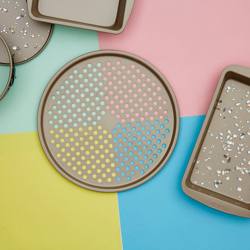 Set of terrazzo-patterned trays on a colorful geometric background