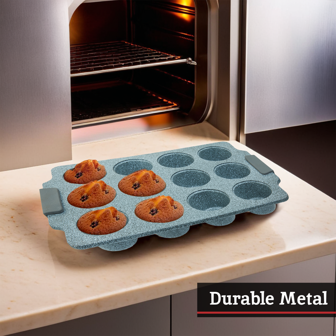 Blue muffin tray with baked muffins on a kitchen counter next to an open oven.