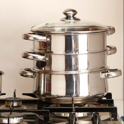 Stainless steel cookware set on a gas stove with &