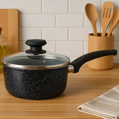 Black speckled cookware pot with lid on a kitchen counter