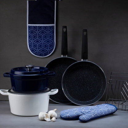 Black cookware set with blue patterned oven mitts on a dark background