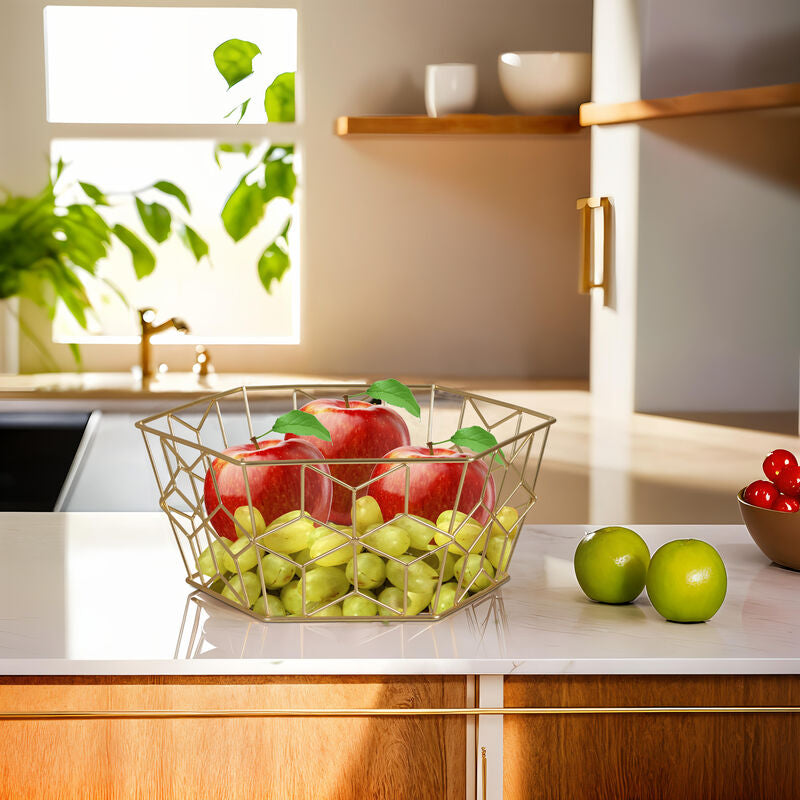 Fruit bowl with apples and grapes on a kitchen counter