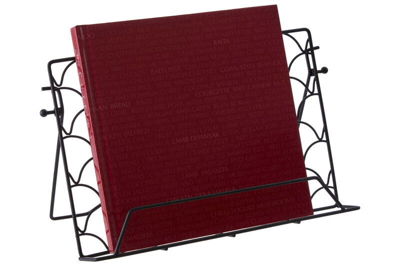 Red book in a black metal holder on a white background