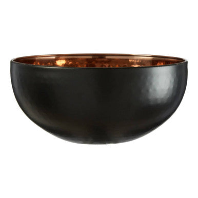 Black bowl with a copper interior on a white background