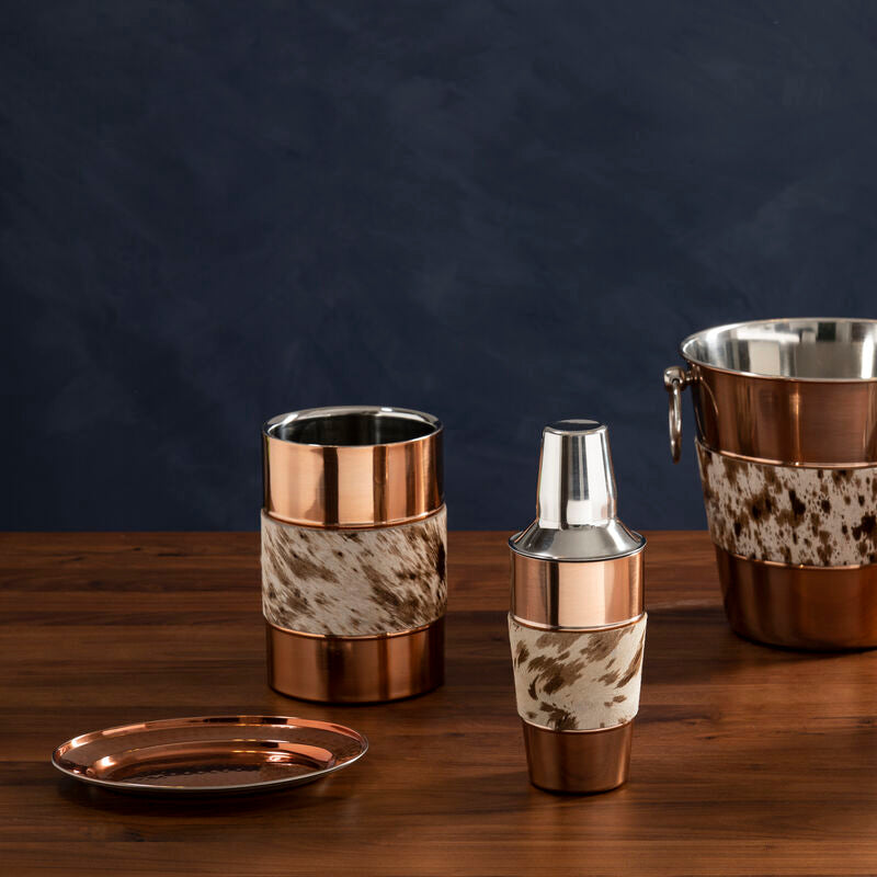 Set of copper and ceramic beverage containers on a wooden surface with a dark background