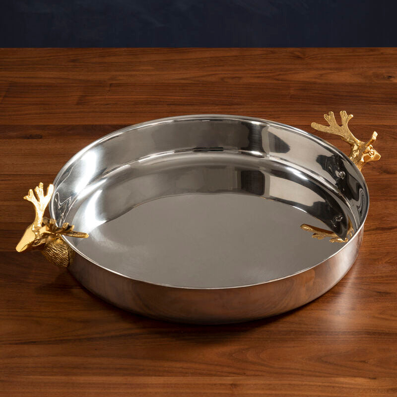 Silver tray with gold leaf accents on a wooden surface