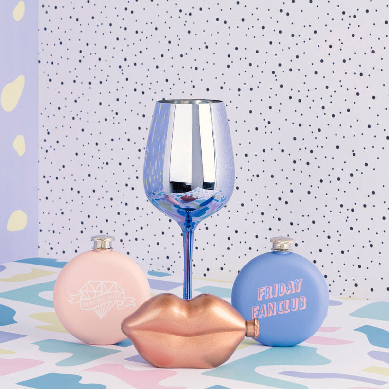 Decorative items including a wine glass, lip-shaped container, and &