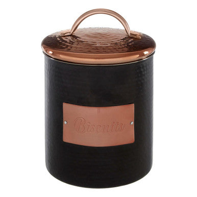 Black ceramic cookie jar with copper lid and label on a white background