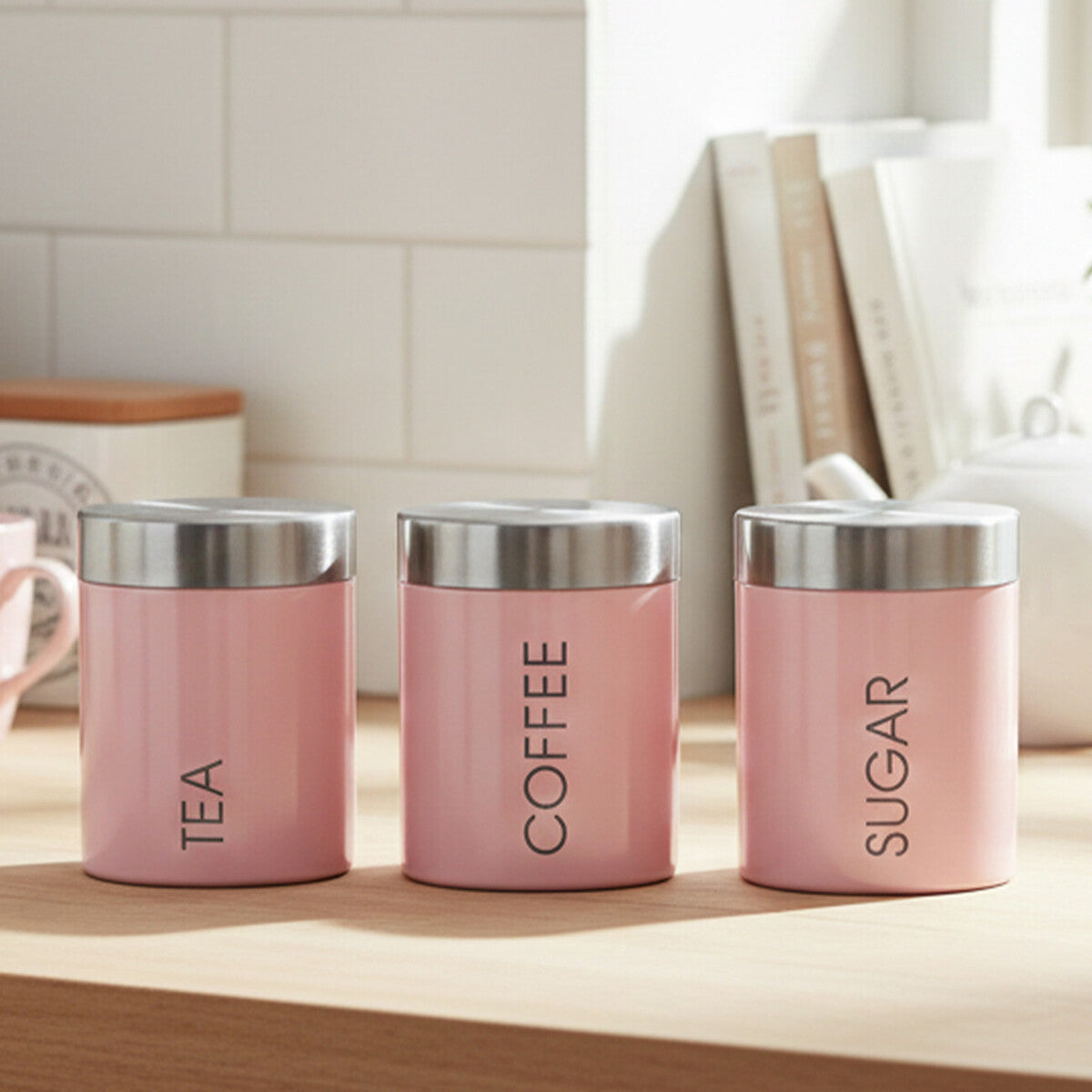 Set of three pink canisters labeled &