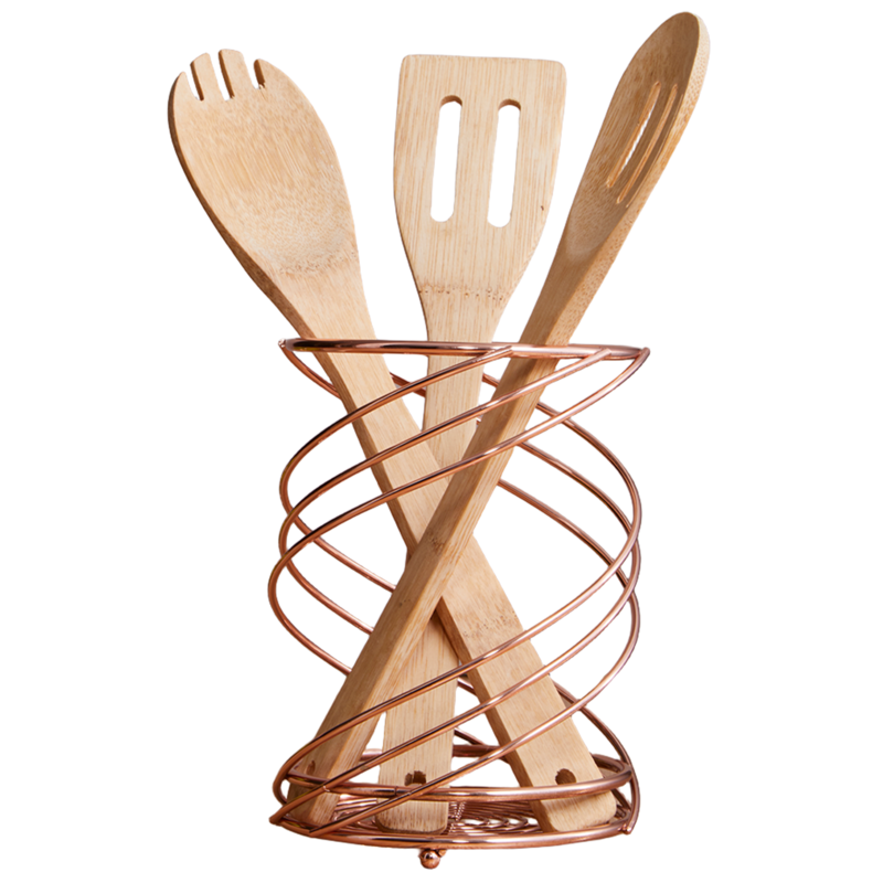 Wooden kitchen utensils in a copper holder on a white background