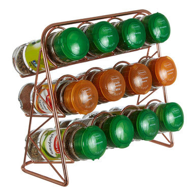 Spice rack with various spice containers on a white background